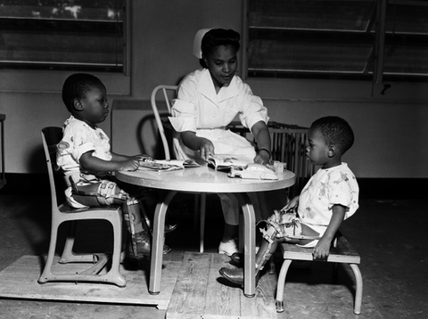 A nurse working with polio patients at FAMU Hospital.